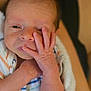 Dominic joined the competition — help win amazing prizes! newborn, baby, infant, face, hand, skin, blanket, striped, curious, wrapped, person, closeup, small, cute, human, expression, soft, sleepy, young, indoors