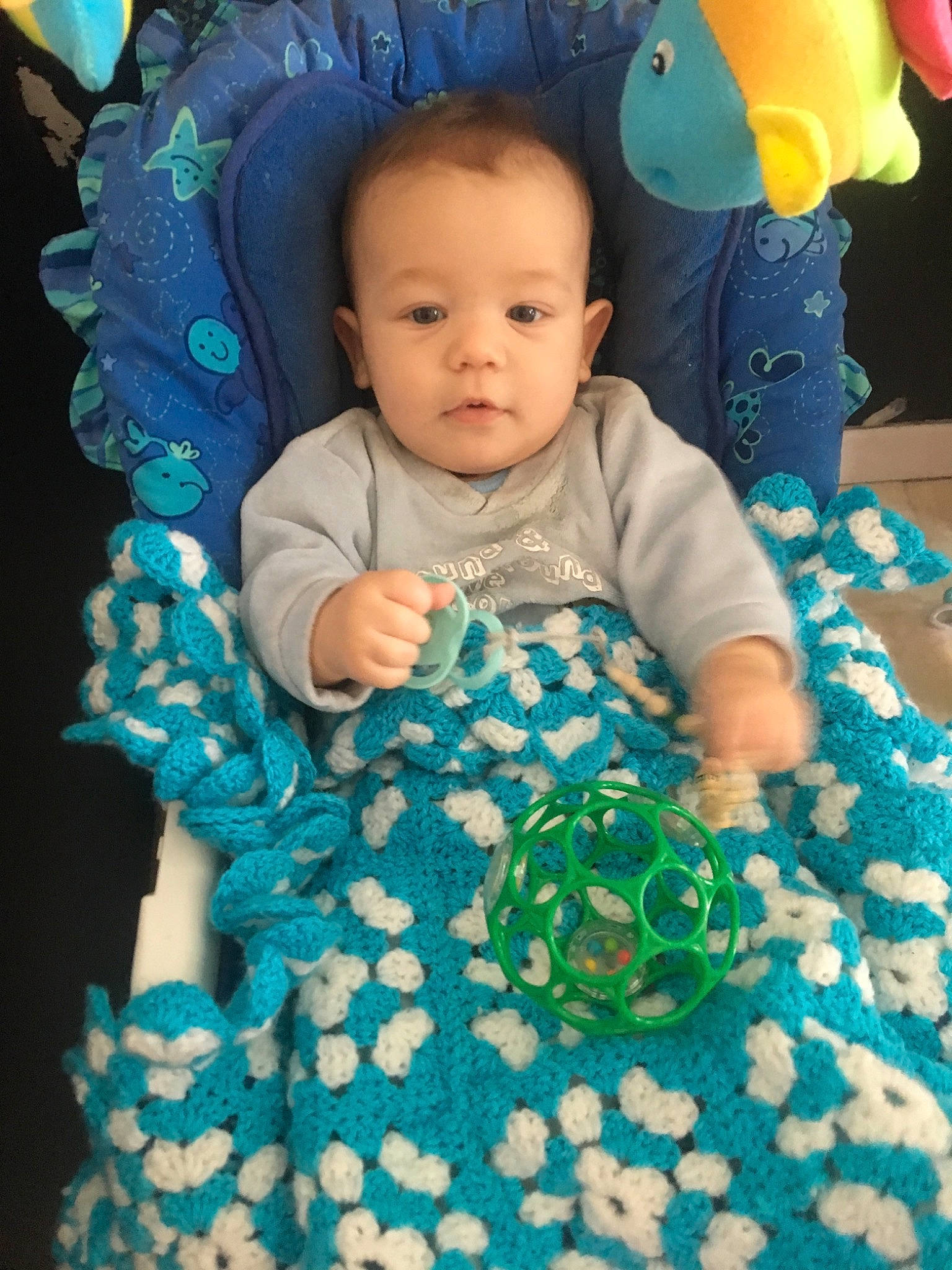 Edzio participe au concours pour gagner de l'argent avec cette photo : blue, child, eye, fun, green, infant, iris, pattern, person, play, product, smile, textile, toddler, toy, turquoise