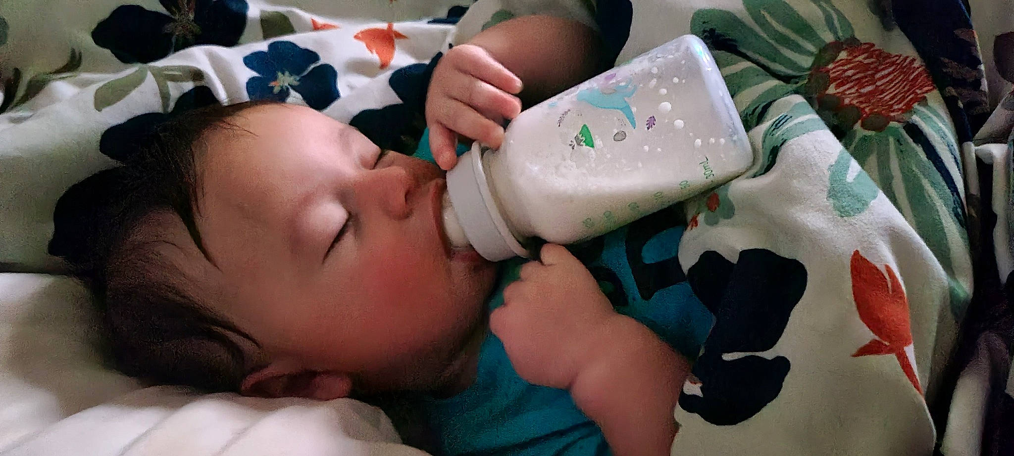Nathan is registered to the contest to win money with this photo: baby, baby_bottle, baby_products, baby_toddler_clothing, cheek, child, comfort, drinking, drinkware, eyelash, finger, health_care, mouth, nail, person, plastic, plastic_bottle, skin, thigh, toddler