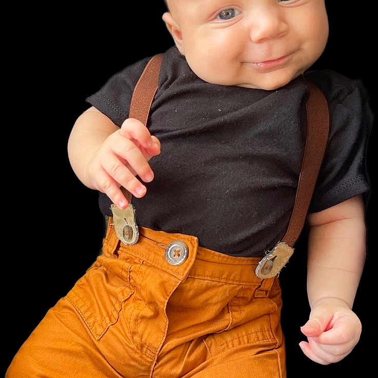 Liam joined the competition — help win amazing prizes! baby, black_shirt, blue_eyes, casual, child, clothing, cute, face, fashion, hand, happy, infant, pants, person, portrait, skin, smiling, studio_photo, suspenders, young_child