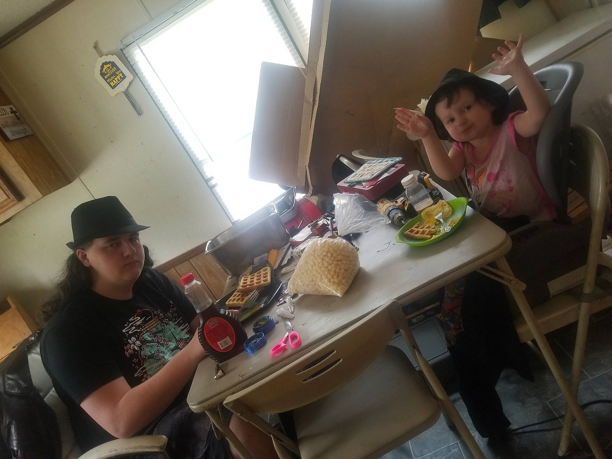 Angela joined the competition — help win amazing prizes! breakfast, chair, coffee_table, comfort, cuisine, desk, fedora, food, fun, hat, headwear, leisure, office_equipment, person, plate, room, shelving, sitting, t_shirt, table