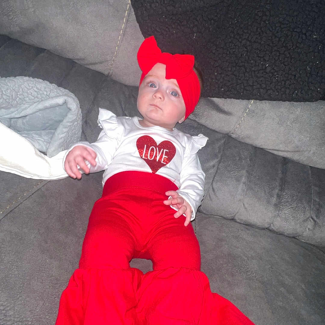 Madilyn is registered to the contest to win money with this photo: baby, baseballcap, bonnet, cap, city, clothing, coat, costume, dress, face, glove, hat, head, jacket, jeans, pants, person, photography, portrait, sleeping