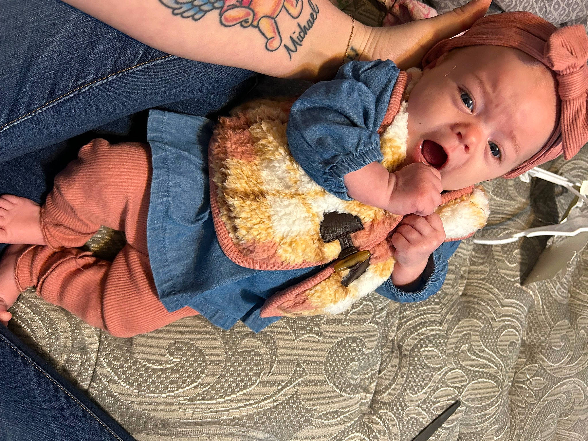 Phoenix is registered to the contest to win money with this photo: baby, baby_products, baby_toddler_clothing, child, comfort, finger, hand, happy, human_body, lap, leg, nail, pattern, person, sitting, skin, textile, toddler, tree, wood