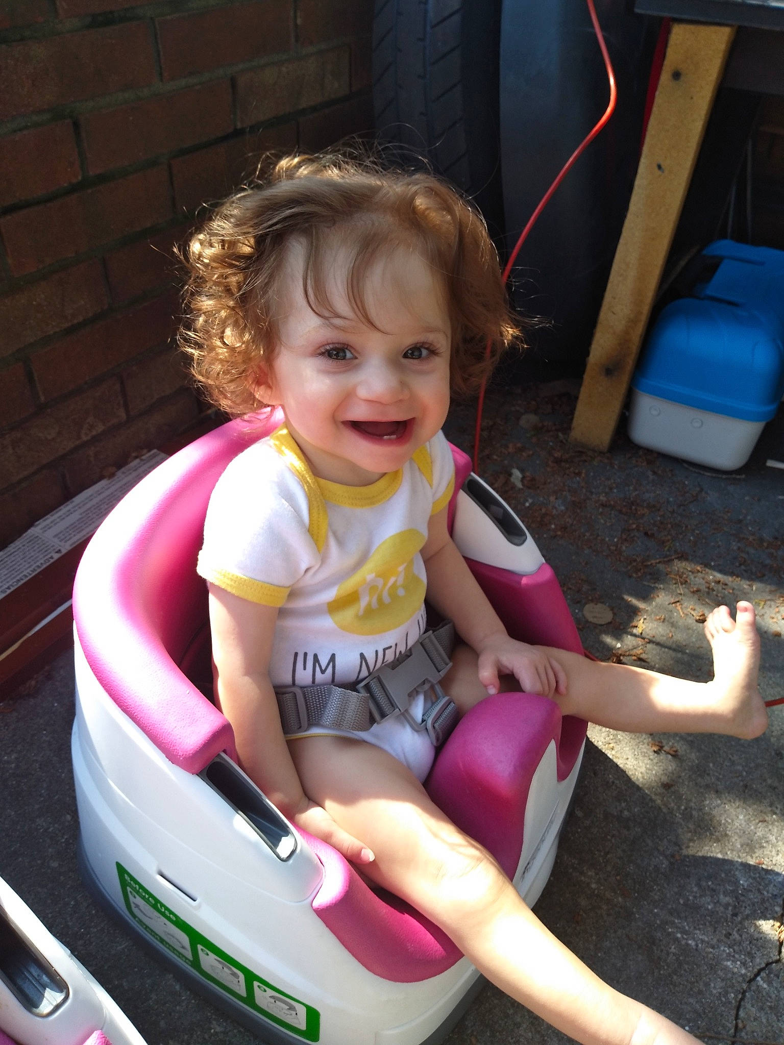 Justice is registered to the contest to win money with this photo: baby, child, fun, joy, leisure, person, pink, play, product, sitting, skin, smile, summer, toddler, vacation