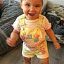 toddler, child, indoor, overalls, yellow, pink_sunglasses, smiling, motion_blur, floor, shoes, happy, person, shorts, shirt, playful, home, furniture, carpet, toy, cute