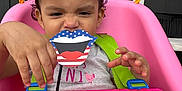 Scarlett joined the competition — help win amazing prizes! toddler, child, swing, pink, little_tikes, toy, playful, face, hand, hair, pigtails, outdoor, window, green_strap, shirt, expression, person, fun, plastic, seat