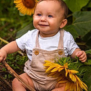 Kaiden is registered to the contest to win money with this photo: baby, child, sunflower, nature, outdoor, greenery, smile, happy, barefoot, stick, plants, leaf, toddler, cute, infant, garden, summer, sunlight, portrait, sitting