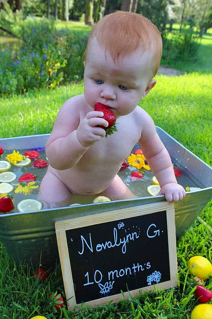 Novalynn is registered to the contest to win money with this photo: baby, baby_toddler_clothing, botany, child, grass, grass_family, green, hand, handwriting, happy, head, lawn, leisure, natural_foods, people_in_nature, person, plant, recreation, summer, toddler