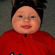 Mya participe au concours pour gagner de l'argent avec cette photo : baby, infant, smiling, face, headband, bow, red_clothing, polka_dot, bunny_patch, cute, lying_down, indoors, closeup, child, cheeks, happy, portrait, apparel, fabric, person