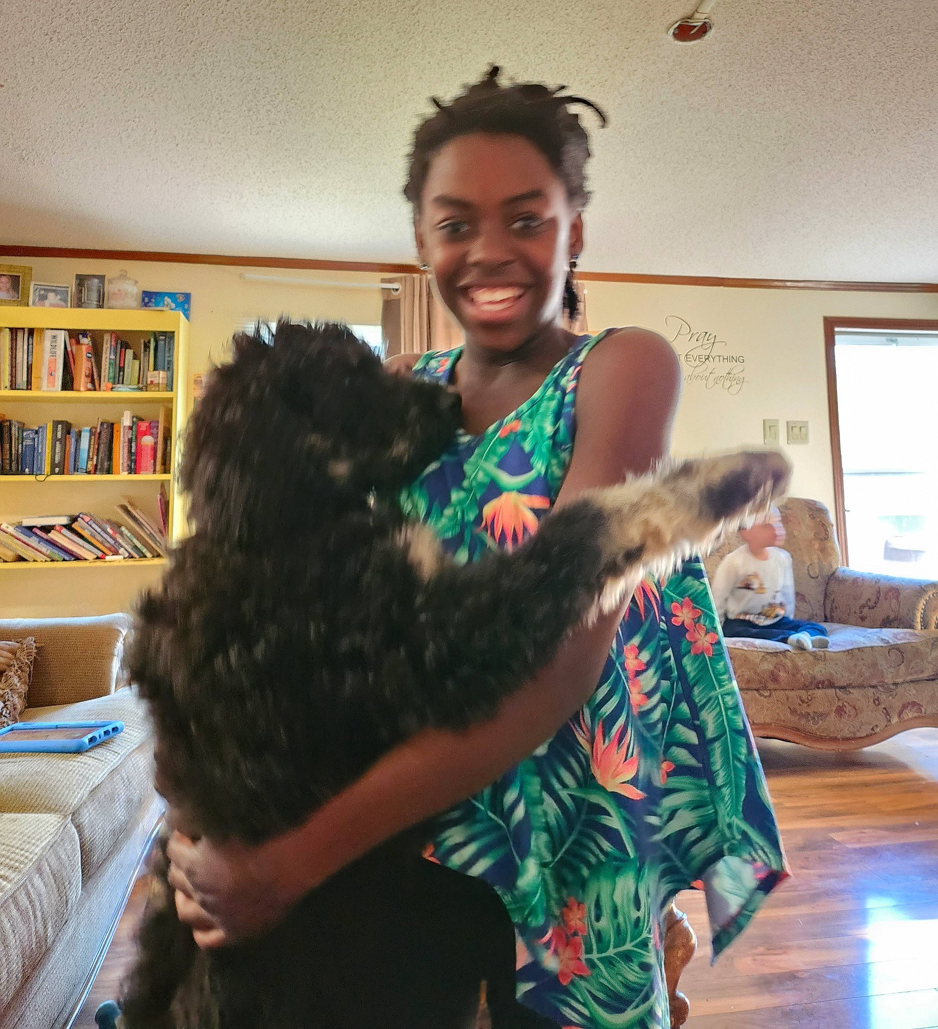 Corie is registered to the contest to win money with this photo: bookcase, carnivore, comfort, companion_dog, couch, dog, dog_breed, event, fashion_design, fun, fur, happy, joy, person, picture_frame, shelf, shelving, shoulder, smile, sporting_group