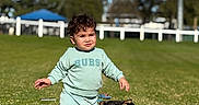 Toviyah joined the competition — help win amazing prizes! toddler, child, puppy, dog, grass, outdoor, sunny, greenery, barefoot, pet, young_child, playing, nature, casual_clothing, happy, cute, walking, summer, daytime, animal