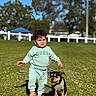 toddler, child, puppy, dog, grass, outdoor, sunny, greenery, barefoot, pet, young_child, playing, nature, casual_clothing, happy, cute, walking, summer, daytime, animal