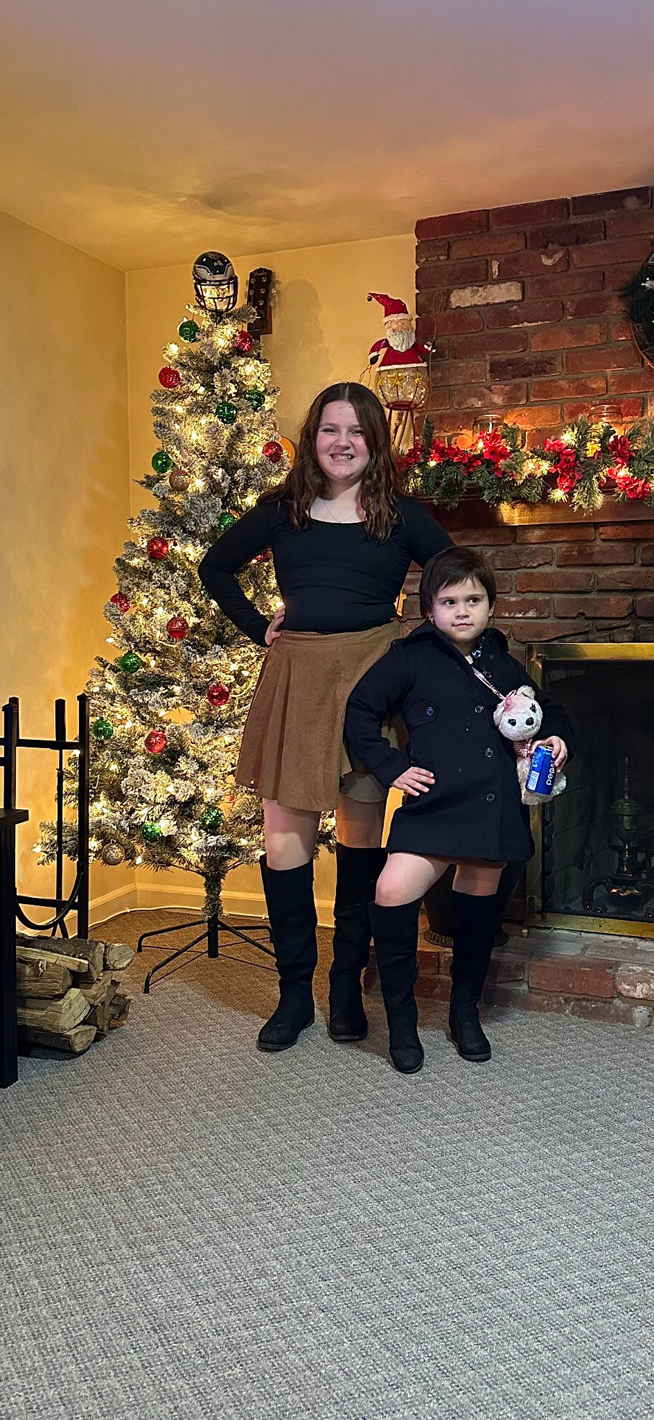 Ciara is registered to the contest to win money with this photo: boot, christmas, christmas_decoration, christmas_ornament, christmas_tree, conifer, event, fun, holiday, holiday_ornament, human_leg, joy, knee, ornament, pattern, person, smile, stocking, thigh, tradition