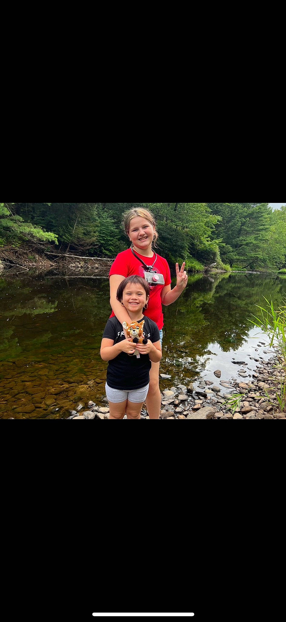 Ciara is registered to the contest to win money with this photo: flash_photography, forest, friendship, fun, grass, happy, joy, lake, landscape, leisure, natural_landscape, people_in_nature, person, plant, recreation, shorts, smile, stream, t_shirt, travel