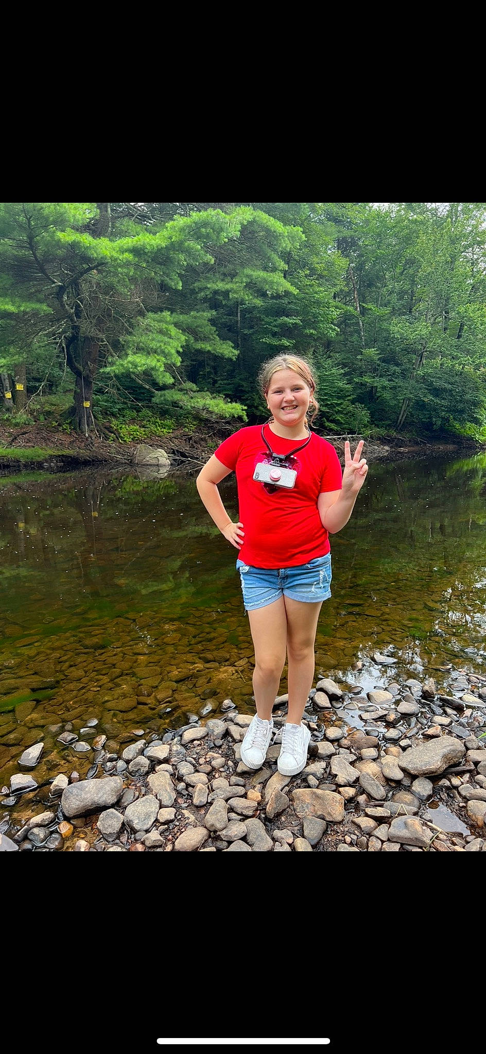 Ciara is registered to the contest to win money with this photo: bank, beauty, body_of_water, fluvial_landforms_of_streams, forest, happy, joy, lake, landscape, leisure, natural_landscape, people_in_nature, person, plant, recreation, shorts, smile, thigh, travel, tree