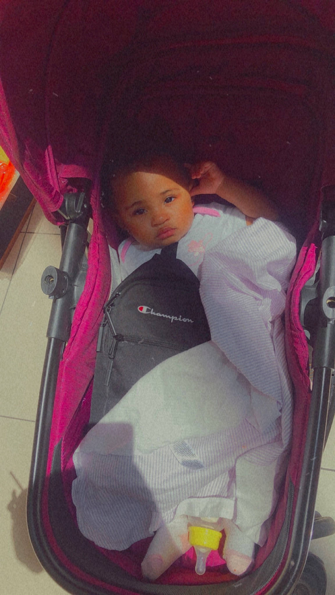 Amor-dior is registered to the contest to win money with this photo: baby, baby_carriage, baby_products, bag, car_seat, child, comfort, doll, fun, infant_bed, magenta, person, pink, product, purple, room, sitting, textile, toddler, toy