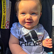 Luca joined the competition — help win amazing prizes! baby, child, infant, smile, blue_eyes, adidas, clothing, car_seat, warning_label, sunlight, portrait, cute, happy, young_child, seatbelt, sitting, indoors, closeup, person, toddler