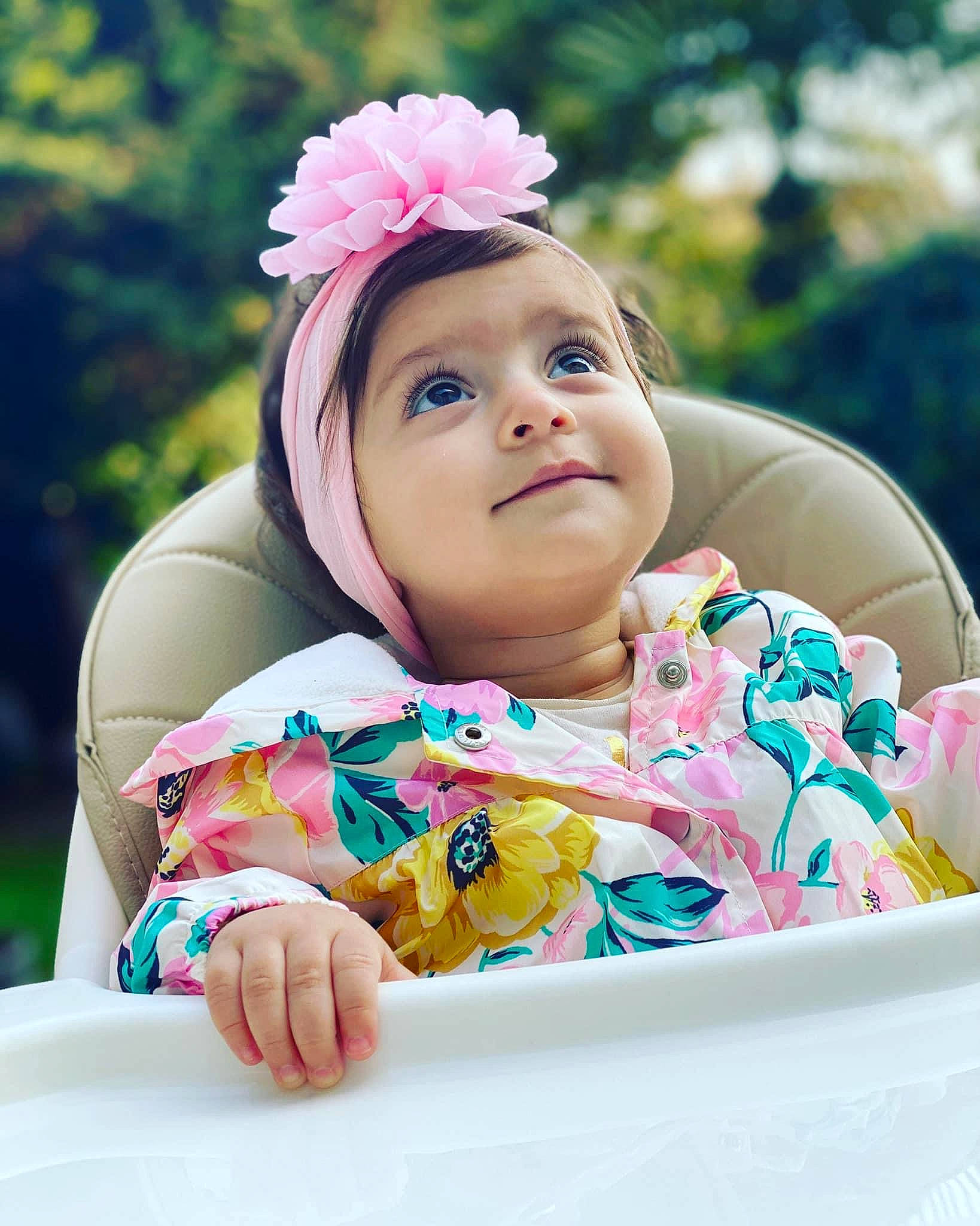 Erika is registered to the contest to win money with this photo: baby, baby_products, baby_toddler_clothing, child, event, fashion_accessory, finger, flower, fun, happy, headband, headpiece, headwear, leisure, magenta, person, pink, recreation, sitting, skin
