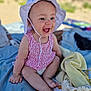 baby, child, smiling, hat, romper, pacifier, blanket, towel, outdoor, sunny, happy, sitting, cute, infant, skin, clothing, daylight, nature, joy, playful