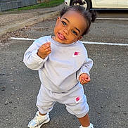 Keyanna participe au concours pour gagner de l'argent avec cette photo : toddler, child, nike, tracksuit, sneakers, parking_lot, car, tree, playful, standing, outdoor, asphalt, sidewalk, person, cute, confident, clothing, head_tilt, smile, urban