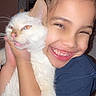 Siméa participe au concours pour gagner de l'argent avec cette photo : affection, animal, blue_shirt, cat, child, closeup, cute, expression, face, feline, happy, hugging, indoor, love, person, pet, portrait, smiling, white_cat, young