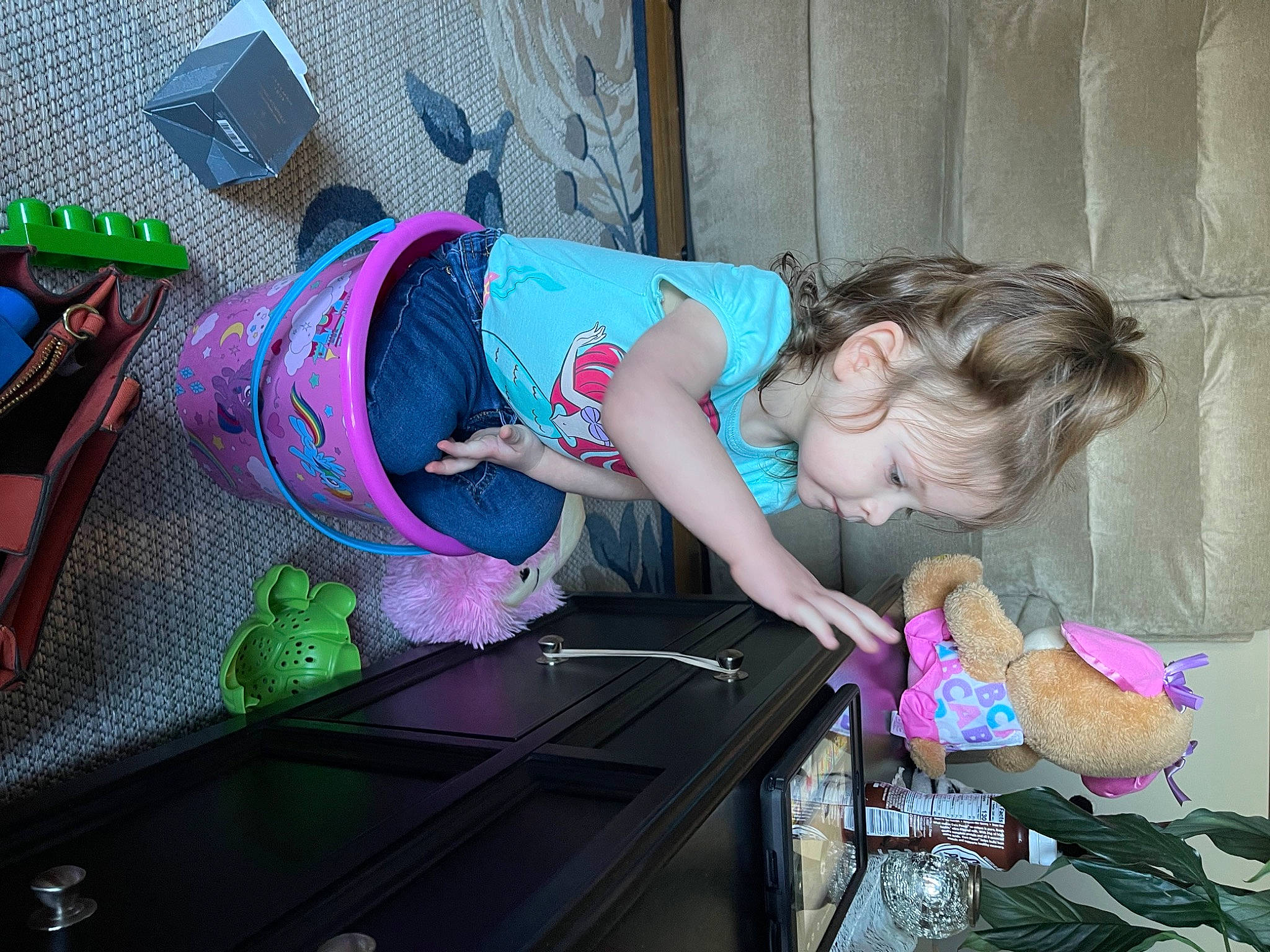 Zophia J is registered to the contest to win money with this photo: audio_equipment, baby, baby_products, baby_toddler_clothing, child, fun, hat, leisure, luggage_and_bags, magenta, person, pink, play, purple, room, sandal, sitting, toddler, travel, tree