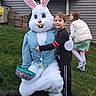 child, boy, easter_bunny, mascot, costume, grass, outdoor, house, window, smile, happy, girl, jacket, basket, green, play, fun, holiday, celebration, spring