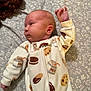 Juniper joined the competition — help win amazing prizes! baby, infant, onesie, milk_carton_pattern, cookie_pattern, bedspread, floral_pattern, sleepwear, child, cute, lying_down, arm_raised, soft_fabric, newborn, portrait, indoor, person, skin, face, head