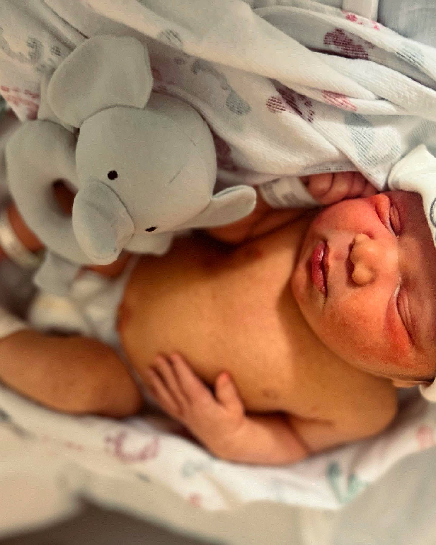 Aries is registered to the contest to win money with this photo: abdomen, baby, baby_products, baby_safety, baby_sleeping, bed, bedding, bedtime, cheek, chest, comfort, eyelash, finger, happy, headgear, linens, person, skin, textile, toddler