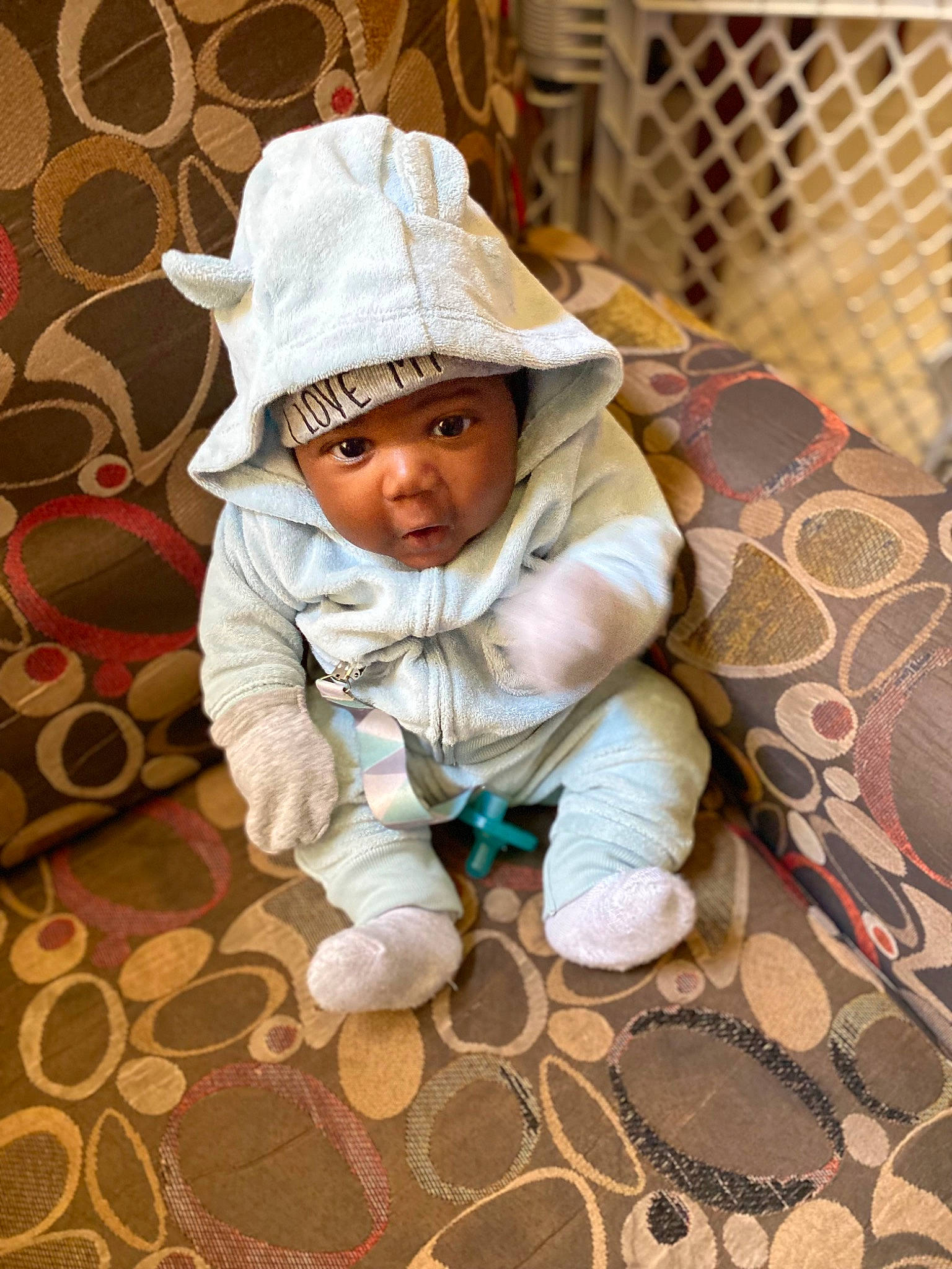 Cairo joined the competition — help win amazing prizes! baby, baby_toddler_clothing, cap, child, comfort, face, fashion_accessory, floor, flooring, grass, happy, hat, headwear, linens, pattern, person, sitting, sleeve, sun_hat, textile