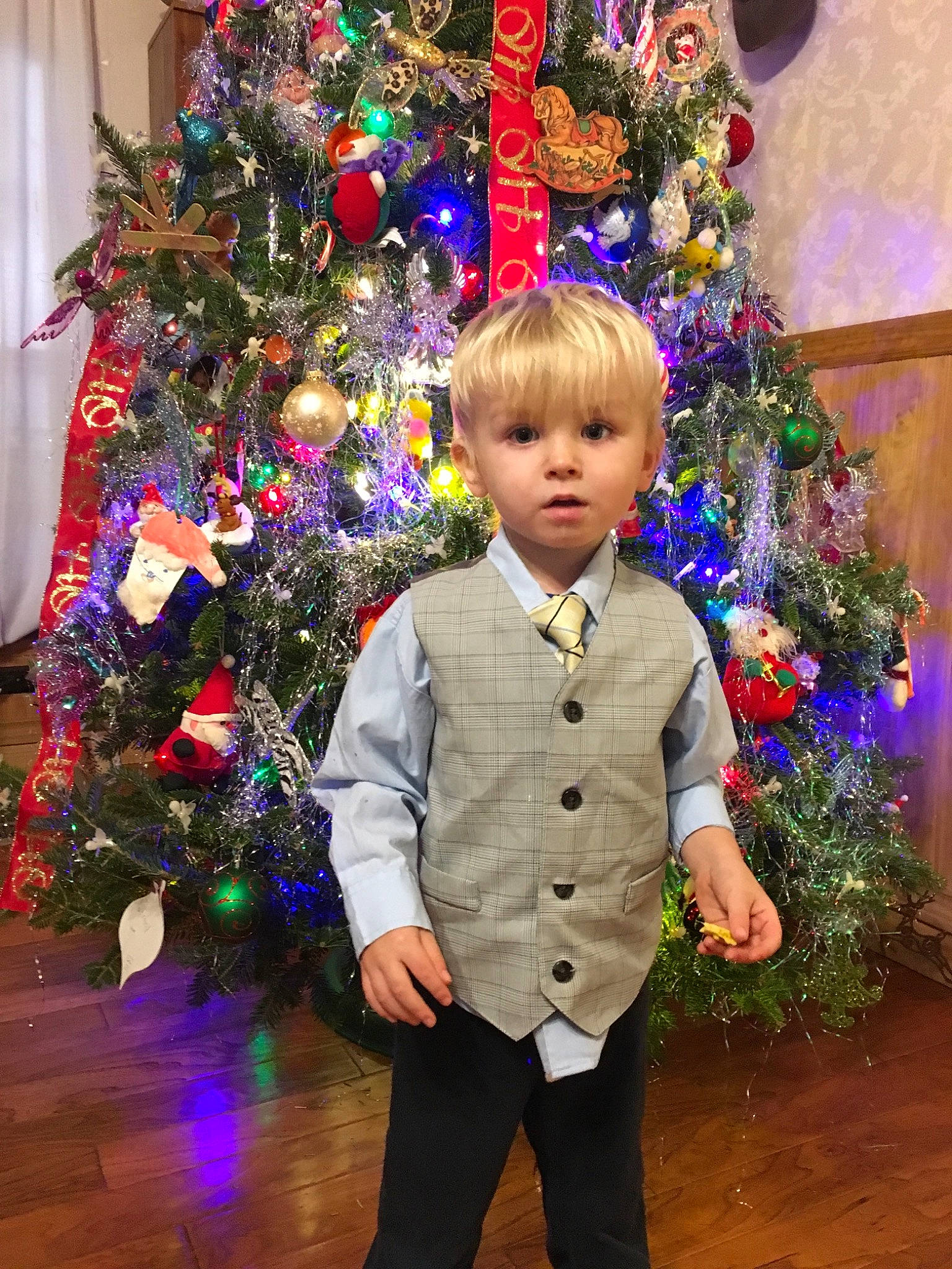Zack joined the competition — help win amazing prizes! child, christmas, christmas_decoration, christmas_eve, christmas_ornament, christmas_tree, event, fir, formal_wear, holiday, holiday_ornament, interior_design, outerwear, person, pine_family, plant, standing, toddler, tradition, tree