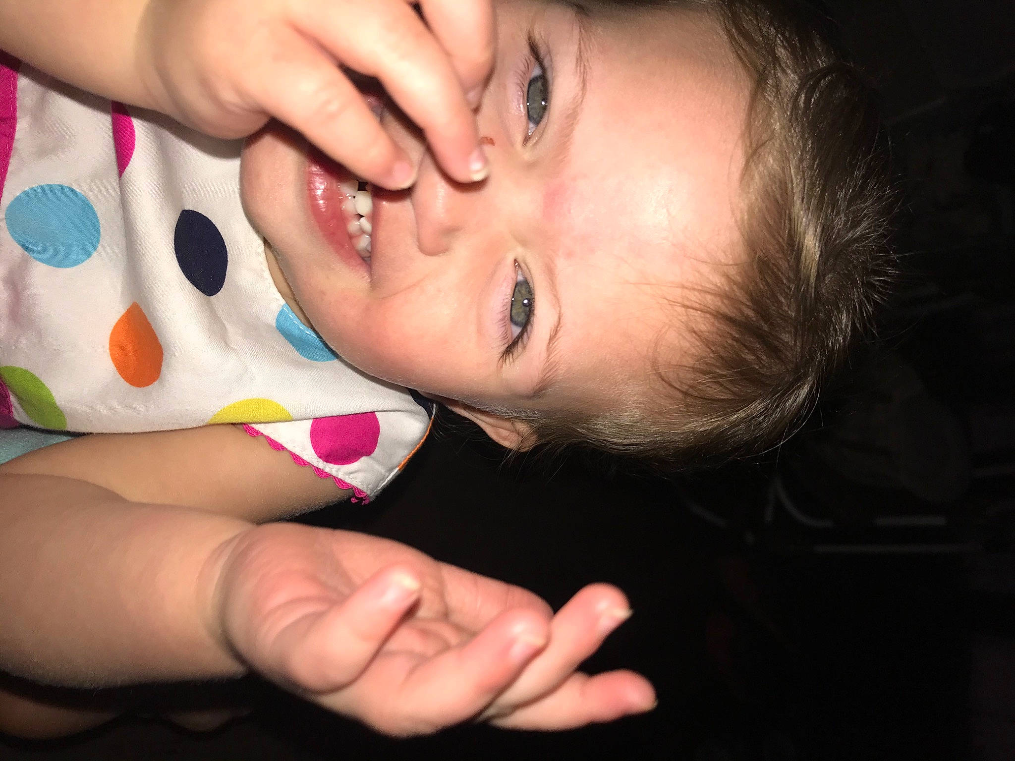 Sophie is registered to the contest to win money with this photo: baby, cheek, child, close_up, eye, eyelash, face, finger, fun, gesture, hand, head, lip, mouth, nail, nose, person, pink, skin, smile