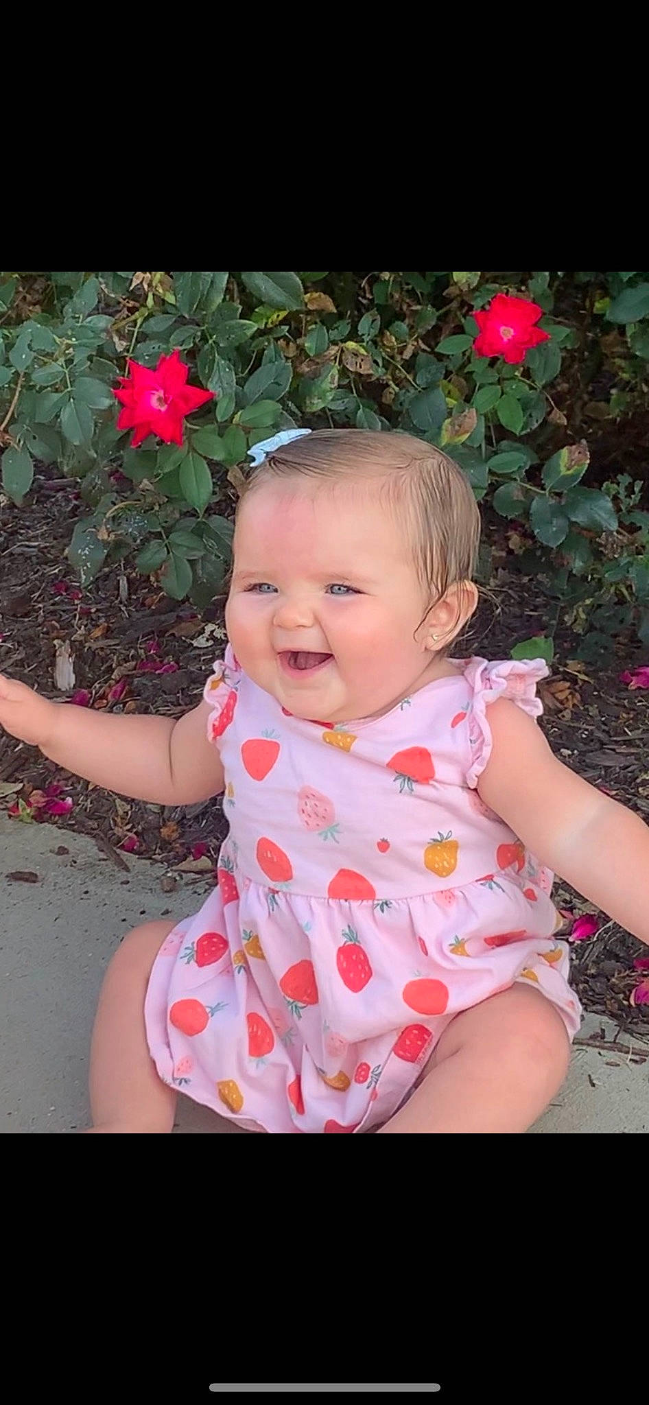 Stormi joined the competition — help win amazing prizes! baby_toddler_clothing, cheek, chin, eye, flash_photography, flower, grass, happy, head, iris, joy, leaf, lip, people_in_nature, person, petal, pink, plant, skin, sleeve