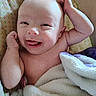 Makenzie joined the competition — help win amazing prizes! baby, infant, blanket, smiling, tongue_out, arm_raised, cushion, seat, patterned_background, skin, happy, cute, child, indoors, closeup, portrait, comfort, soft_texture, playful, expression