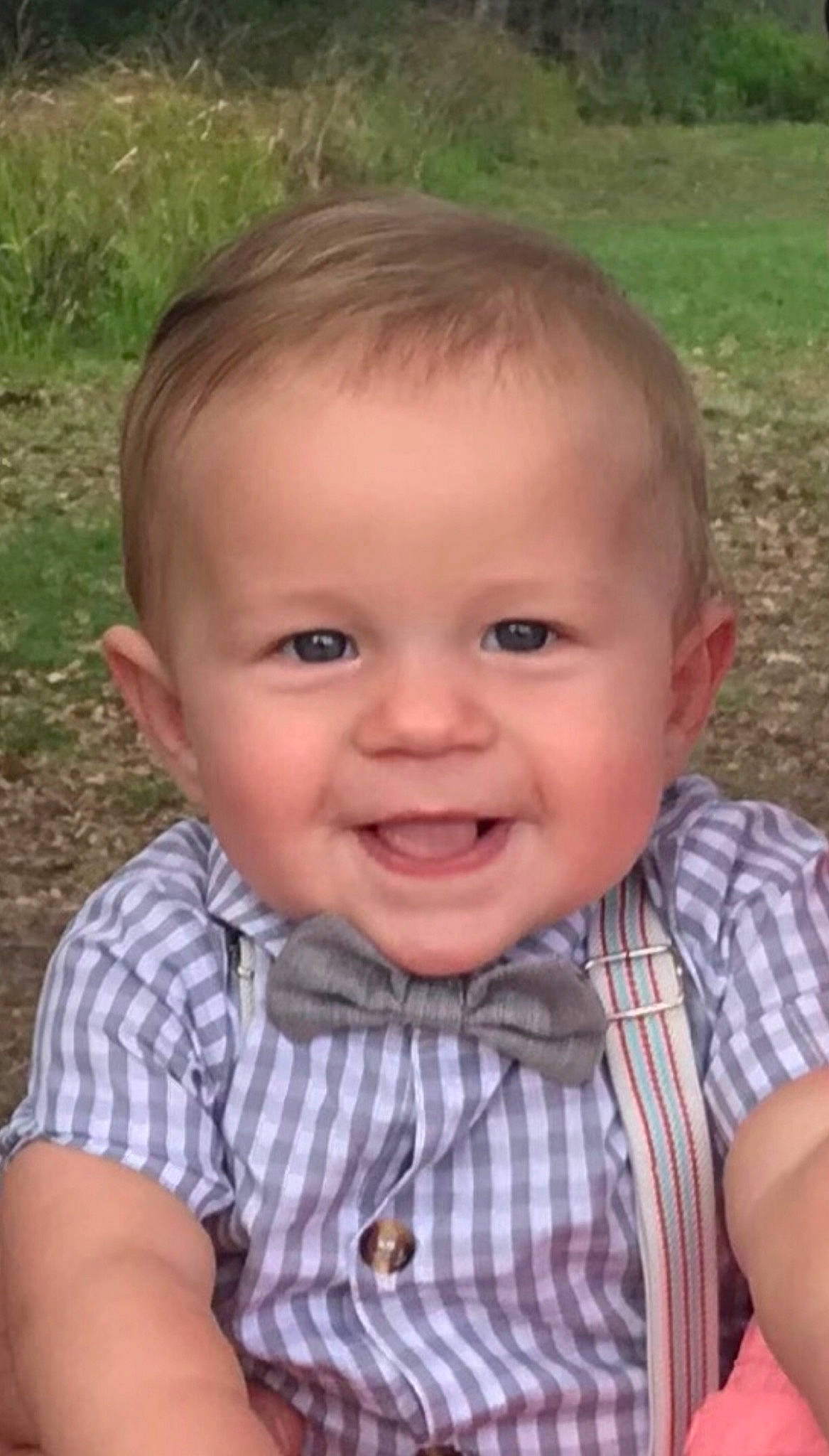 Harrison is registered to the contest to win money with this photo: baby, baby_toddler_clothing, cheek, chin, clothing, eye, facial_expression, forehead, grass, happy, head, iris, joy, lip, mouth, nose, person, skin, sleeve, smile