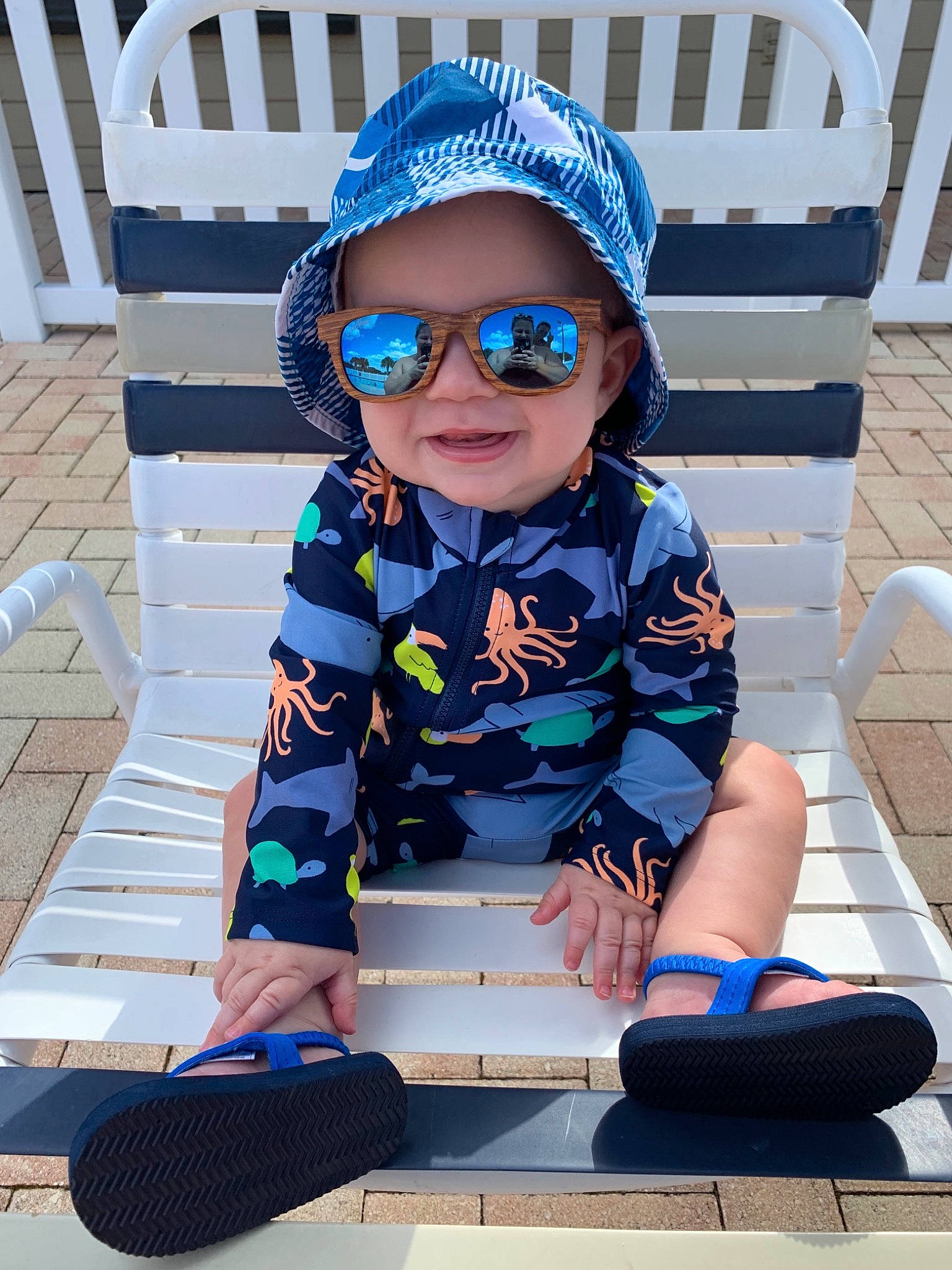 Harrison is registered to the contest to win money with this photo: azure, baby_toddler_clothing, blue, cap, child, cool, electric_blue, eyewear, fun, glasses, goggles, headwear, leisure, person, sleeve, smile, street_fashion, summer, sunglasses, t_shirt