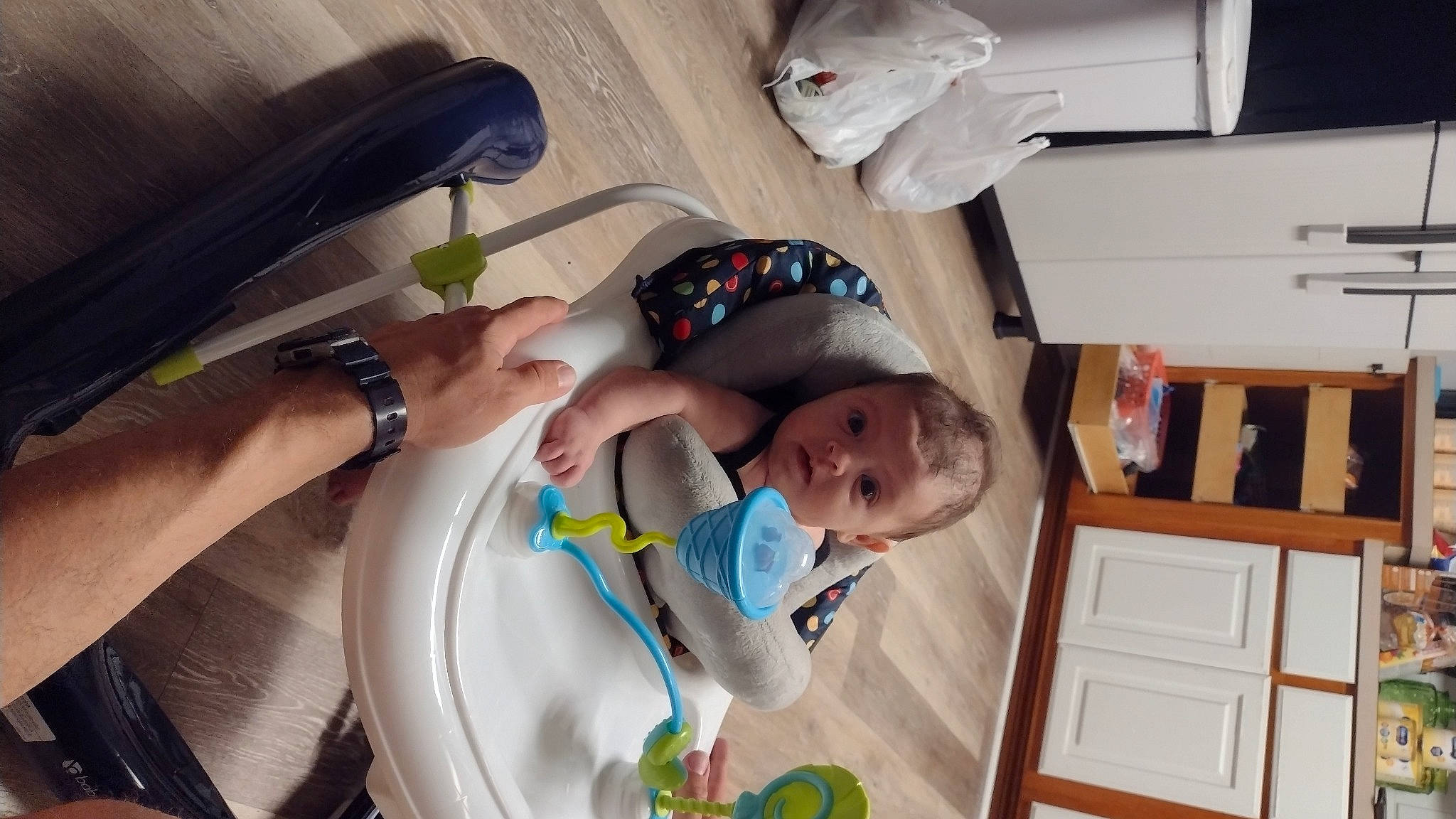 Rachel is registered to the contest to win money with this photo: baby, baby_products, baby_safety, baby_toddler_clothing, child, clock, comfort, fun, hat, nail, person, room, surprise, thumb, toddler, watch, wood, wrist