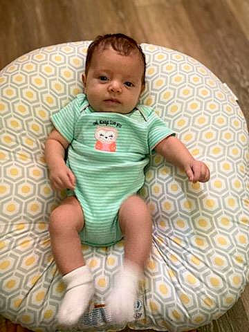 Rachel is registered to the contest to win money with this photo: baby, baby_products, baby_safety, baby_toddler_clothing, bib, chair, cheek, child, circle, comfort, happy, linens, pattern, person, product, sitting, sleeve, smile, t_shirt, textile