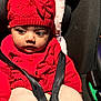 baby, car_seat, child, child_seat, closeup, cute, headwear, indoors, infant, knitwear, looking_away, person, portrait, red_hat, red_sweater, safety_harness, seatbelt, small_hands, soft_texture, warm_clothing