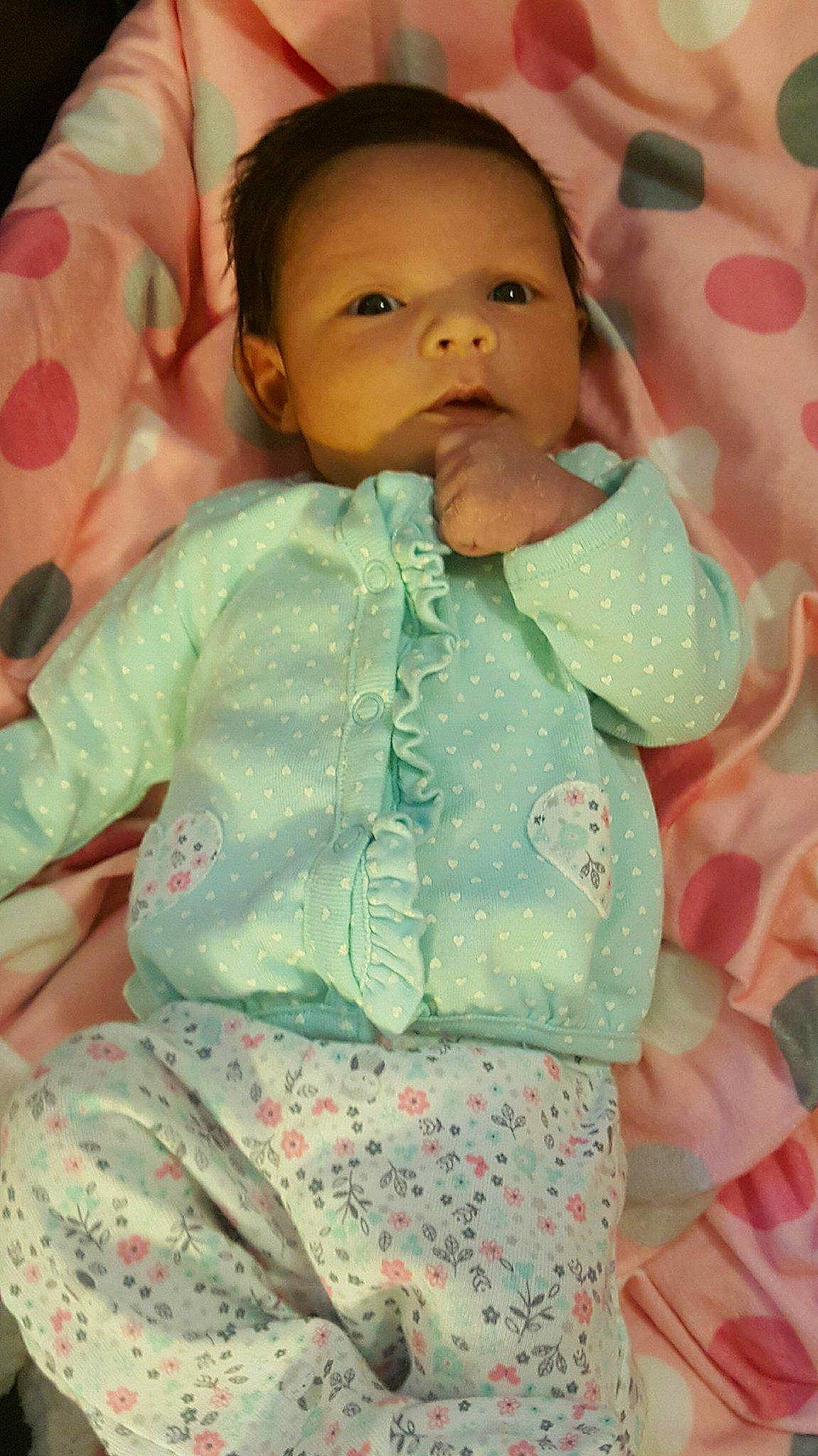 Lilyanna is registered to the contest to win money with this photo: cheek, child, girl, green, head, infant, iris, person, pink, product, skin, textile, toddler