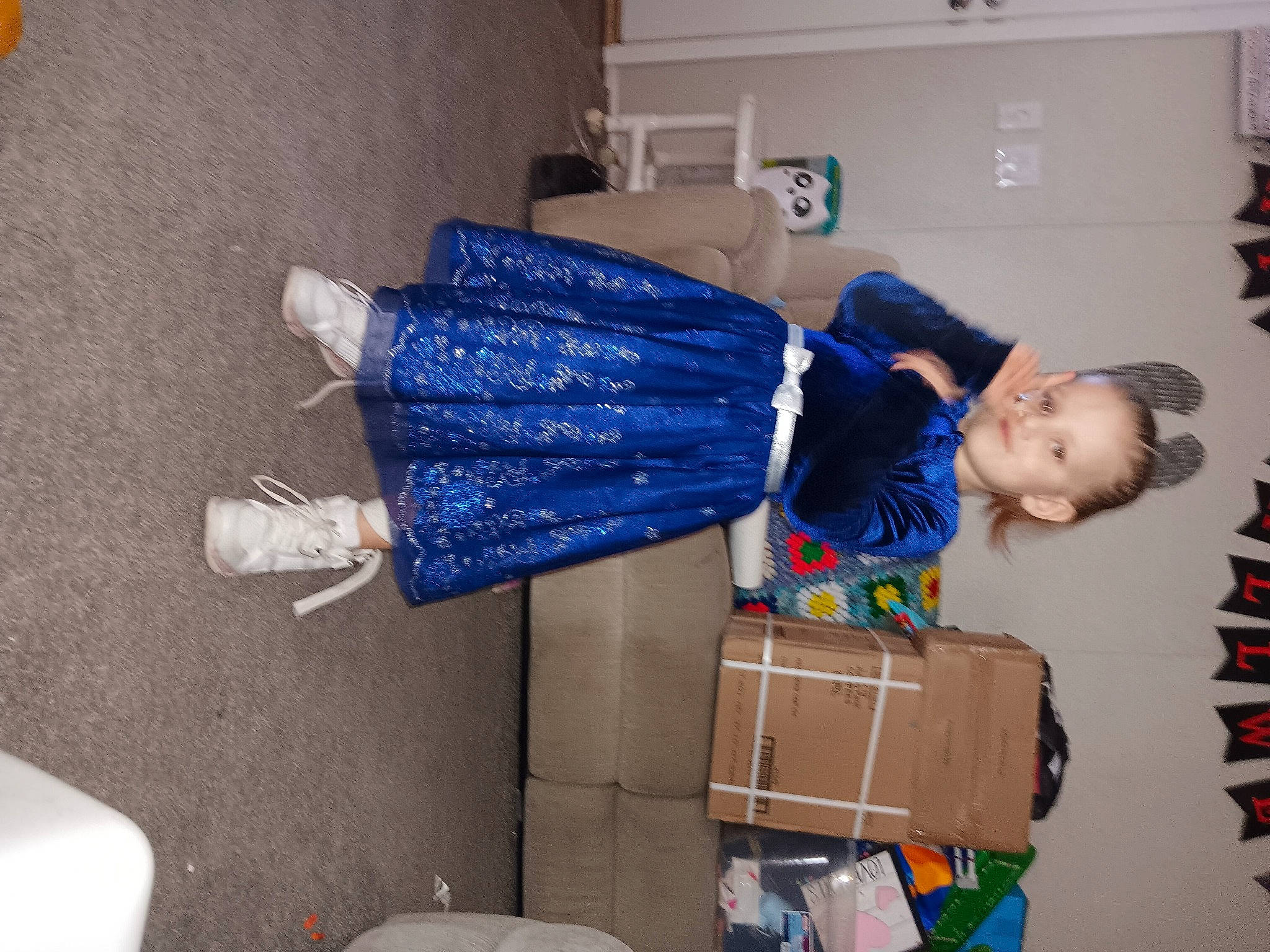 Aricee is registered to the contest to win money with this photo: box, cardboard, carton, electric_blue, human_leg, package_delivery, packing_materials, person, plastic, plastic_bag, relocation, room, shipping_box, snapshot, travel, wood, wrist