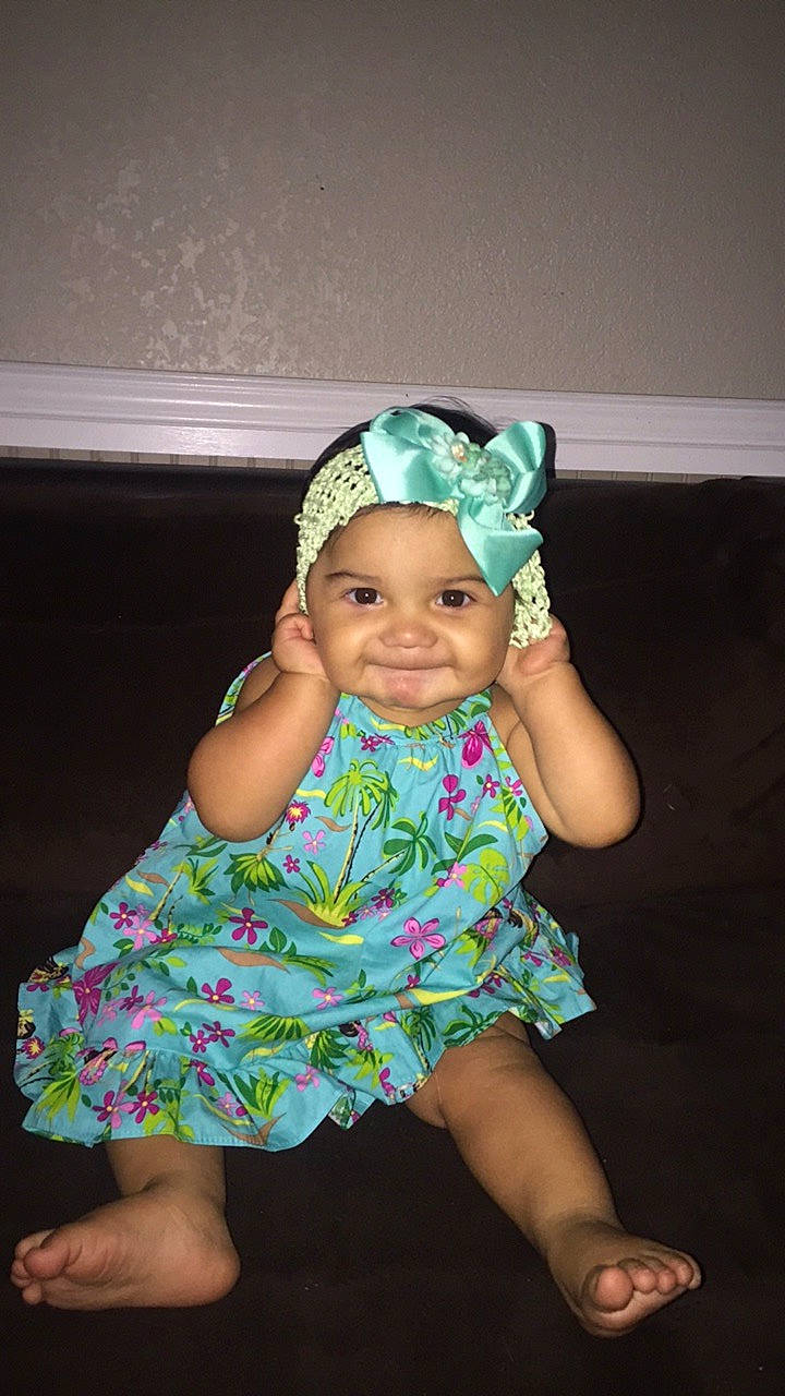 Anyah is registered to the contest to win money with this photo: baby, baby_toddler_clothing, child, clothing, costume_accessory, dress, fashion_accessory, hair_accessory, headband, headgear, headpiece, joy, person, smile, toddler