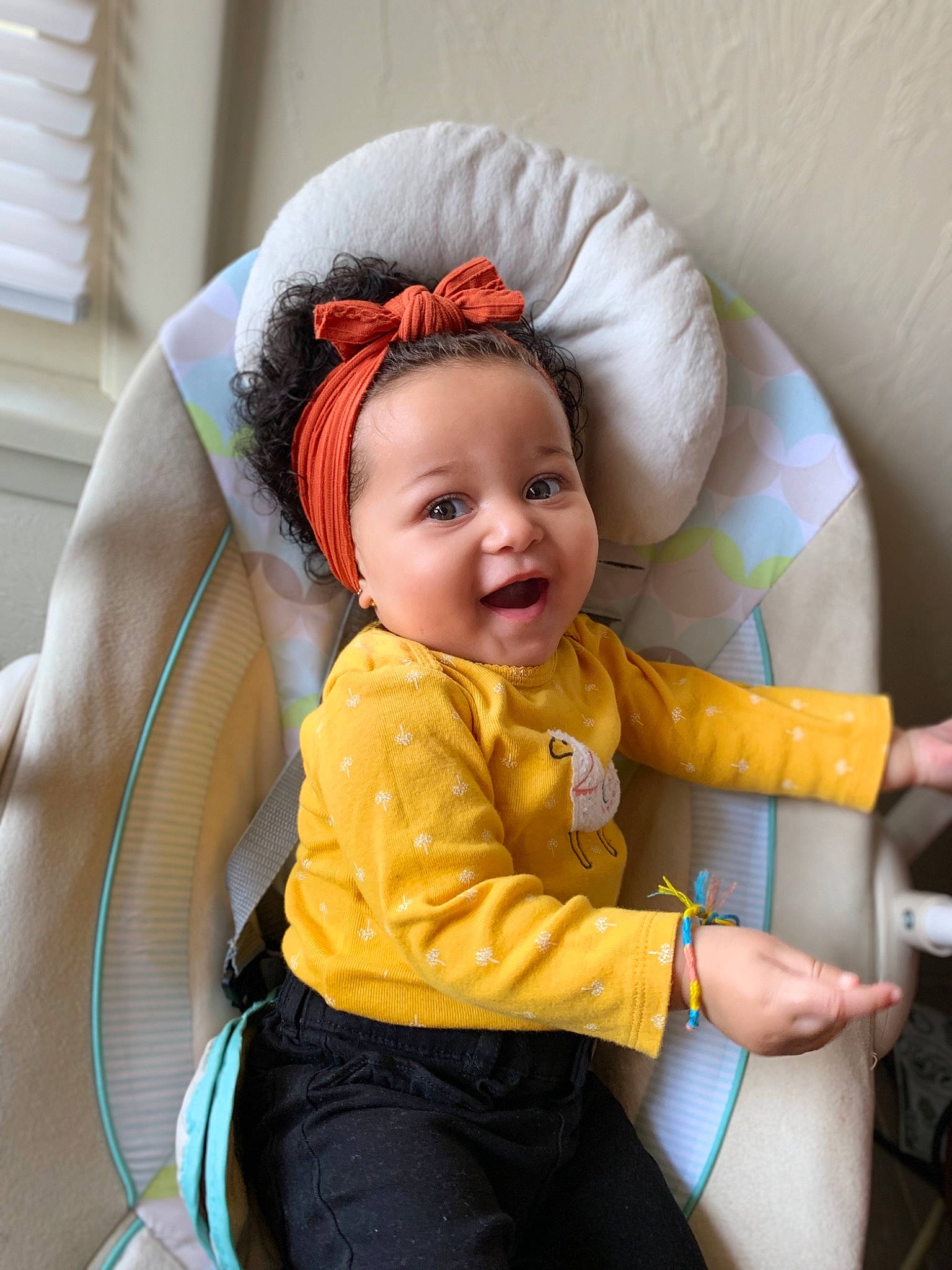 Joy is registered to the contest to win money with this photo: baby, baby_products, child, ear, fun, hair_accessory, headband, person, play, sitting, skin, toddler, yellow