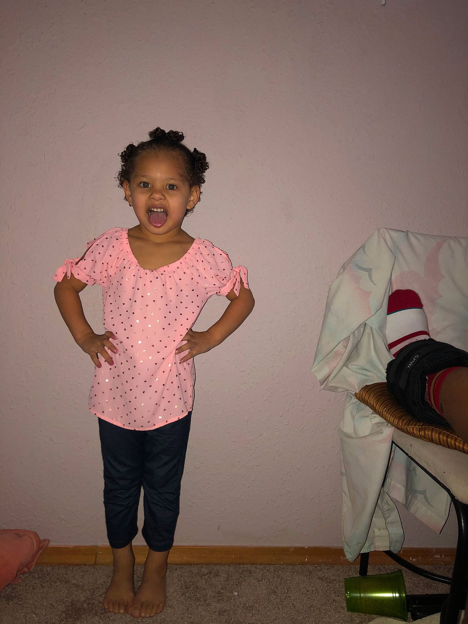 Ellianna is registered to the contest to win money with this photo: child, fun, joint, pattern, person, pink, shoulder, sleeve, standing, t_shirt, toddler