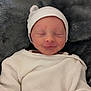 Ewen Evain a rejoint le concours — aidez-le/la à gagner de superbes lots ! newborn, baby, infant, sleeping, white_clothing, hat, blanket, soft_texture, peaceful, closeup, face, portrait, cute, tiny_hands, resting, indoors, cozy, warm, smiling, child