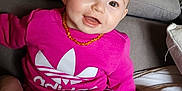 Nëyla a rejoint le concours — aidez-le/la à gagner de superbes lots ! adidas, baby, child, couch, cozy, face, furniture, happy, head, home, indoor, infant, necklace, person, pink_clothing, plush_toy, portrait, sitting, smiling, toy