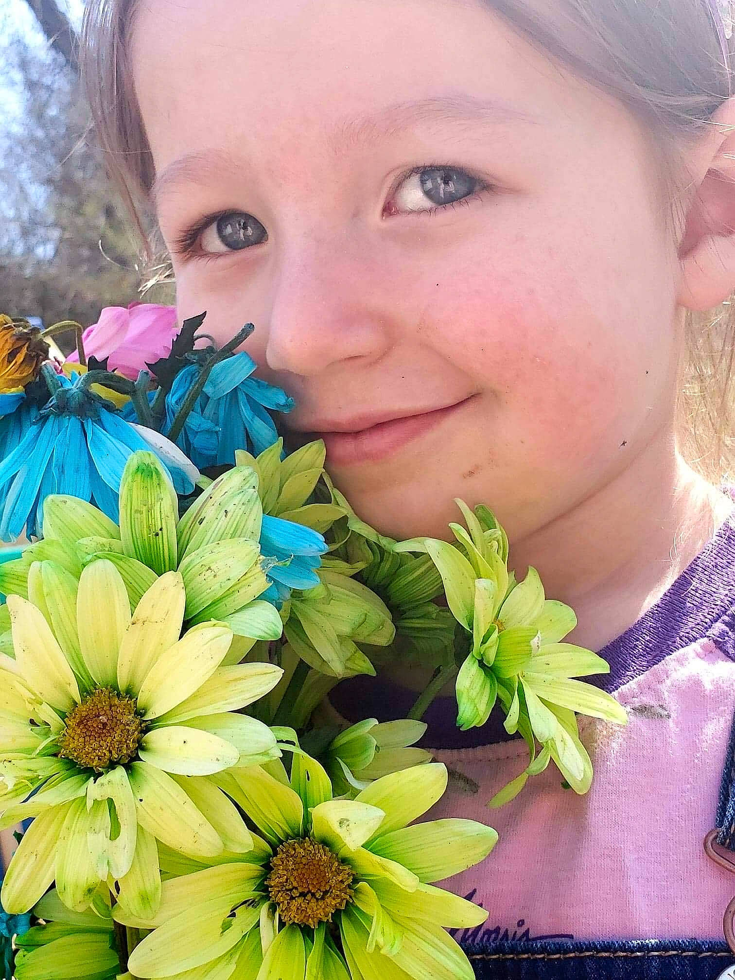 Jackie is registered to the contest to win money with this photo: beauty, blue, bouquet, cheek, child, close_up, cut_flowers, eye, face, flower, happy, iris, joy, olfaction, person, petal, photography, plant, smile, spring