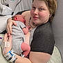 Oakley joined the competition — help win amazing prizes! newborn, baby, parent, hospital, bed, tattoo, piercing, skin, clothing, pillow, hand, face, person, infant, hospital_bed, medical_bracelet, blanket, resting, love, family