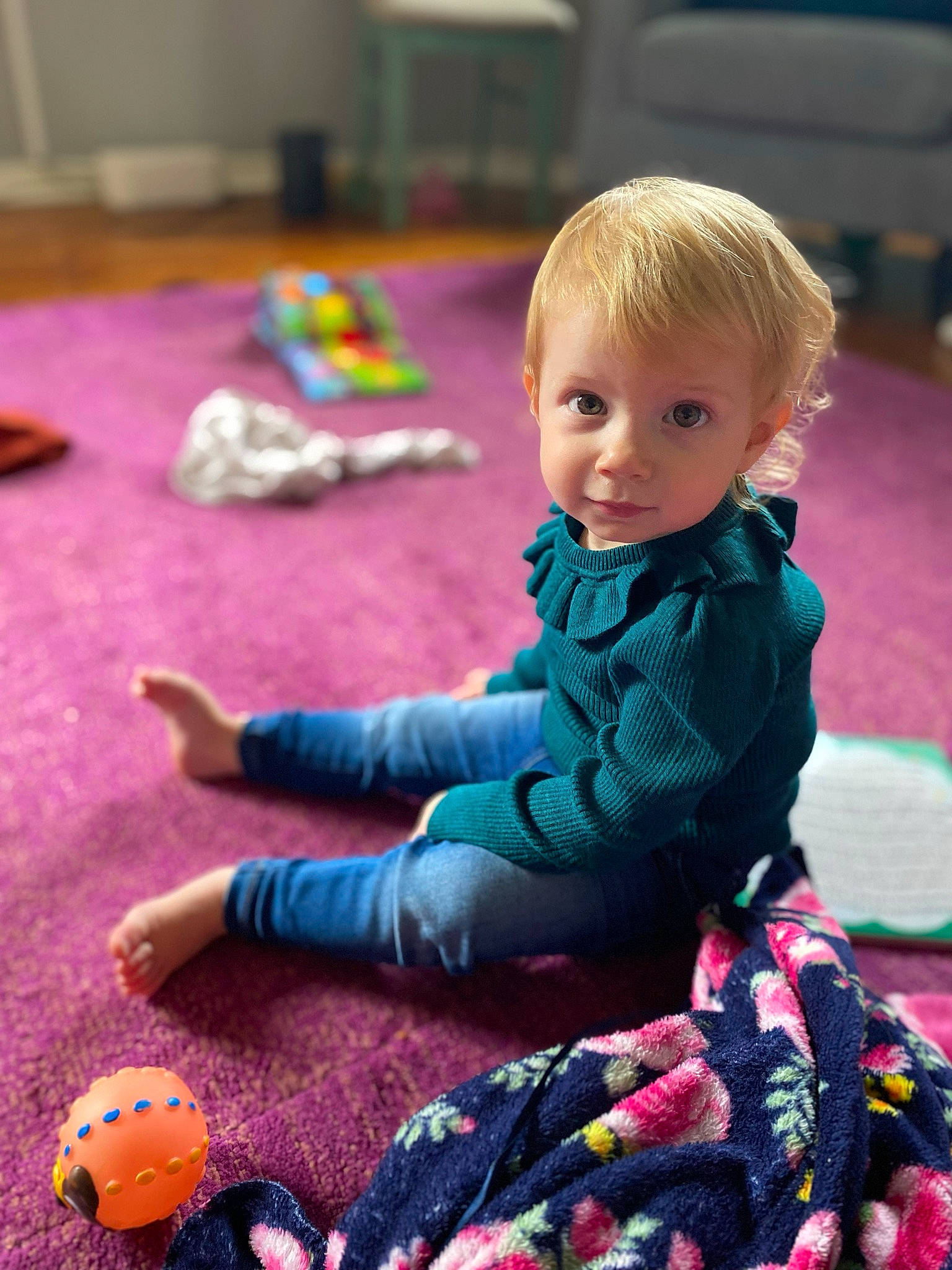 Aurelia is registered to the contest to win money with this photo: baby, baby_toddler_clothing, black, child, eye, face, floor, flooring, fun, leisure, magenta, mammal, person, photograph, pink, product, purple, skin, textile, toddler