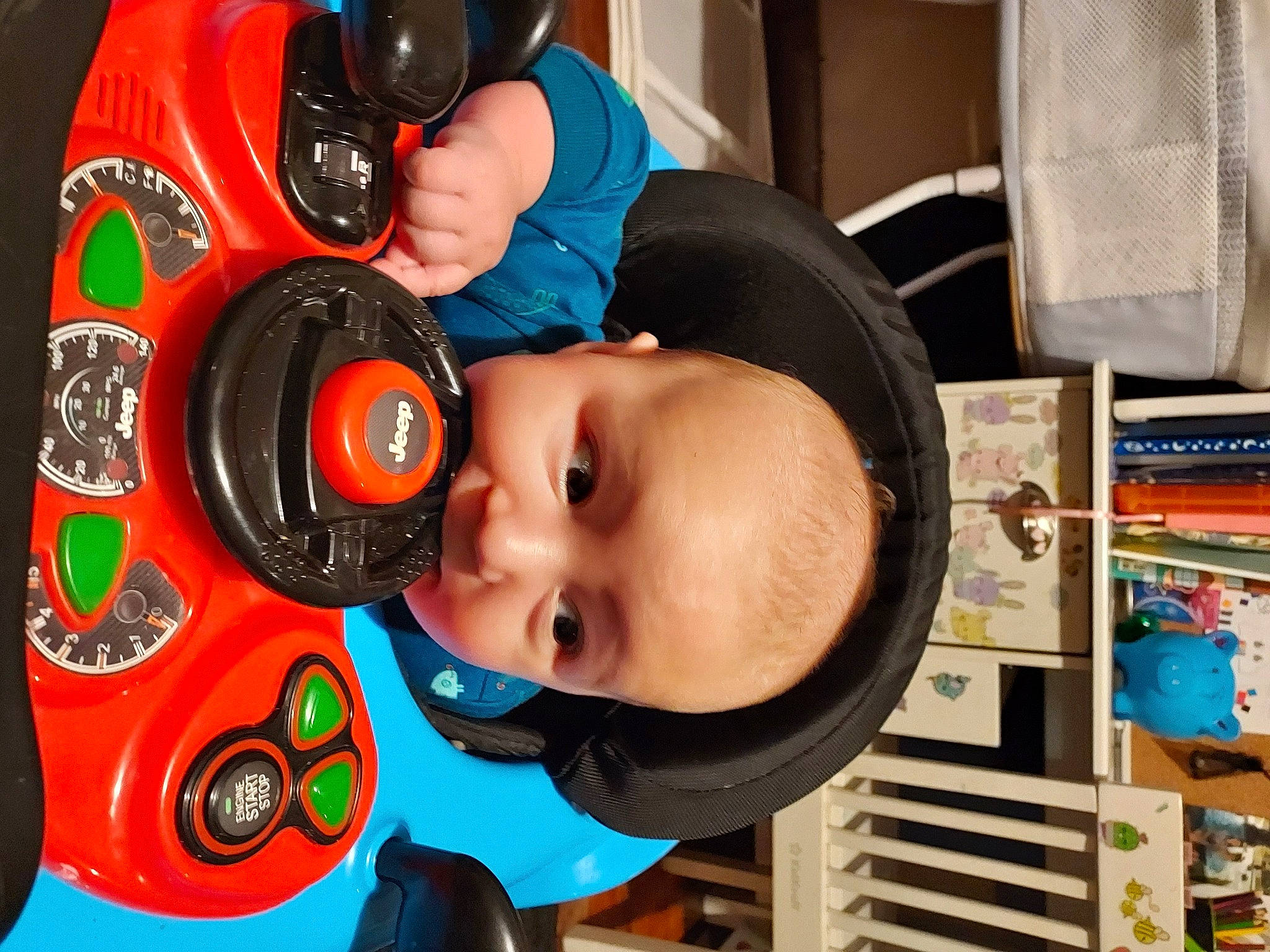 Leon is registered to the contest to win money with this photo: audio_equipment, baby, baby_products, baby_toddler_clothing, child, fun, gadget, hat, headgear, helmet, nose, person, personal_protective_equipment, product, room, shelf, smile, sports_gear, t_shirt, toddler
